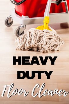 a mop and bucket with the words heavy duty floor cleaner on it next to a red duster