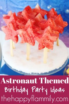 an astronaut themed birthday party with watermelon pops and strawberries on the top