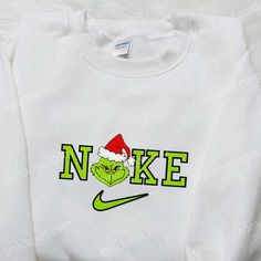 Introducing the Grinch Christmas x Nike Movie Embroidered Sweatshirt, a must-have for all Nike enthusiasts and Christmas lovers! This unique Nike Inspiration, Nike Inspired, Unique Sweatshirt, Cartoon Shirts, Cartoon Sweatshirts, Family Christmas Gifts, Hoodie Material, Embroidered Clothes, Embroidered Sweatshirt