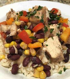 a white plate topped with rice and beans