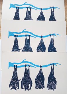 three pieces of paper with drawings of clothes hanging on the clothesline and one is blue