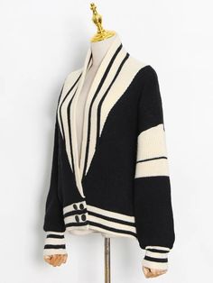 Fabric: Knit Beige Knit V-neck Cardigan, Chic Cream Sweater For Fall, Chic Cream V-neck Cardigan, Cream Knit V-neck Outerwear, Chic Chunky Knit Cardigan, Elegant Beige Soft Knit Cardigan, Trendy Textured Knit Beige Cardigan, Chic Knitted Sweater Coat For Work, Oversized Chic Knit Cardigan