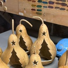 some pears with christmas trees on them and a blue toothbrush