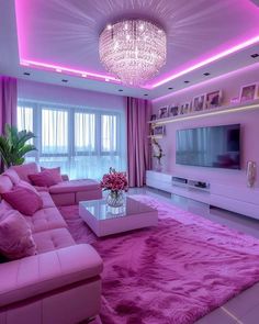 the living room is decorated in pink and white colors with chandelier above it