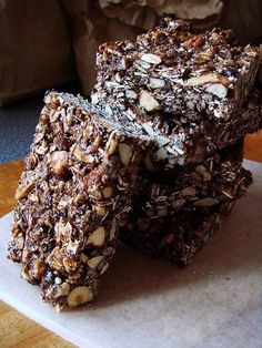 three pieces of chocolate granola bars stacked on top of each other in front of a couch