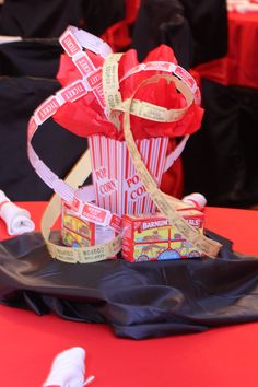 a red and white box with some candy in it sitting on top of a table