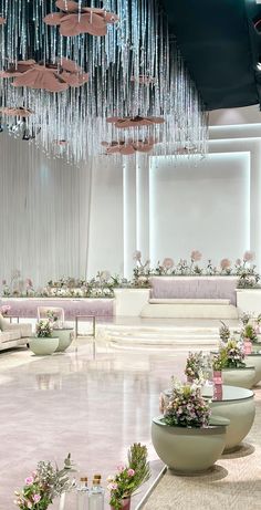 a room filled with lots of tables covered in flowers