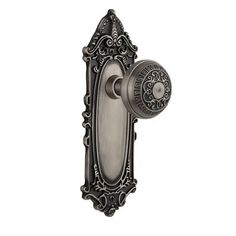 an antique style door handle with glass knob