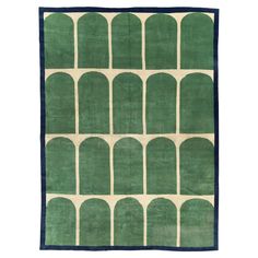 a green rug with arches on it