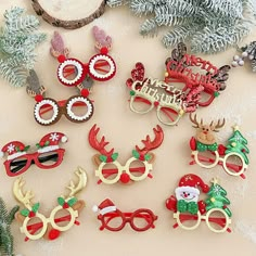 christmas decorations made out of plastic and decorated with santa's glasses, reindeers and snow