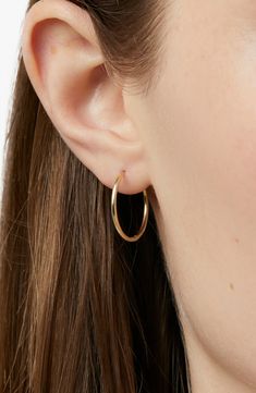 These medium gold hoops are your new hoop staples. Solid in both structure and design, these 100% recycled gold hoops will elevate any look and add shine to your everyday. Pair them with our Gold Huggie Hoops for a stack made to stand the test of time. 10k recycled solid gold Medium gold hoop earrings Perfect for everyday Width: 19.7mm - 0.78" Depth: 1.3mm - 0.05" Weight: 0.56g Hoop Diameter:14.8mm - 0.58" Post: 10K Solid Gold Hinge Clasp Crafted In Mexico Jewelry Earrings Aesthetic, Gold Earrings Delicate, Small Gold Hoops Aesthetic, Small Gold Hoops Earrings, Hoop Earring Ideas, Gold Hoops Aesthetic, Gold Hoop Earrings Aesthetic, Loop Earrings Gold, Simple Jewelry Earrings