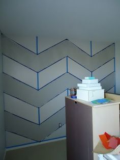 an empty room with blue lines painted on the wall