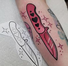 a tattoo on the leg of a person with a knife and heart shaped object in it