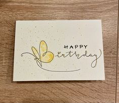 a card with the words happy birthday written in cursive writing and a butterfly on it