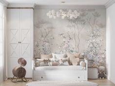 a living room with floral wallpaper and white furniture