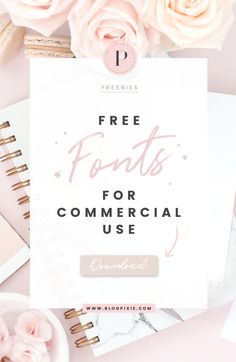 the free font for commercial use with pink flowers and notebooks on top of it