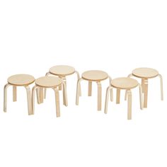 four wooden stools sitting next to each other