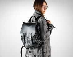 "This Artemis backpack is made out of cotton jeans with a black houndstooth pattern and black soft Italian cow leather. It is fully lined with a cotton fabric. A backpack that you can take everywhere. Perfect for daily use or during your travels. If you have a lot of gear to carry, this fits it all without being bulky. The regular size comfortably accommodates a 13\" laptop while the mini size fits a tablet and a water bottle nicely. You can use the three external zippered pockets, two small ones on the sides and one larger in the back for transportation cards, phones, passports, car keys, or anything you wish to have quick access to. Whenever a need for extra room, you can just leave the gusset open. It comes in two sizes to choose from. FEATURES * The flap secures with two sets of magnet Black School Bag For Fall, Black Bags For School In Winter, Black School Bag For Winter, School Backpack For Fall, Standard Backpack For Everyday Use In Fall, School Backpack With Adjustable Strap For Fall, Fall Satchel Backpack For Daily Use, Fall School Backpack With Adjustable Strap, Everyday Fall Backpack