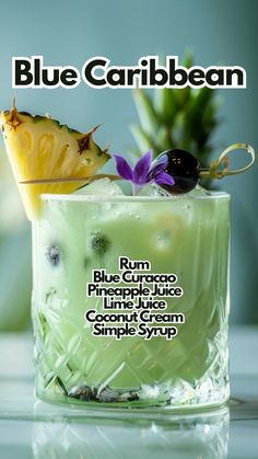 a blue caribbean drink in a glass with a pineapple on top