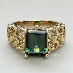 Gorgeous 3 Carat Green Andesine 14 Karat Yellow Gold Ring. Gorgeous Emerald Cut Green Andesine In Intricate 14 Kt Yellow Gold Setting. Interlocking Circles Setting And Filigree Basket For Andesine. Andesine Varies From Emerald Green To Forest To Olive Depending On Light. Andesine Is 8 X 10 X 5 Mm (Approximately 3 Carats). Marked 14k. 5.4g Yellow Gold Setting, Yellow Gold Ring, 3 Carat, Yellow Gold Rings, Womens Jewelry Rings, Emerald Cut, Emerald Green, Gold Ring, Circles