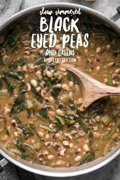 a pot filled with black eyed peas and greens