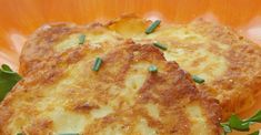 two crab cakes on a plate with parsley