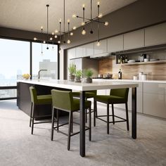 a modern kitchen with an island and bar stools