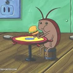 a cartoon bug eating a hamburger on top of a table