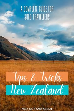 an open field with mountains in the background and text overlay that reads, a complete guide for solo travelers tips & tricks new zealand