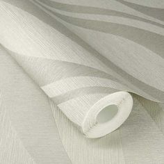 an image of a wallpaper with grey and white stripes on the walls, as well as a roll of tape