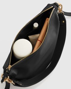 Buttery soft, perfectly slouchy and entirely timeless, our Italian Leather Convertible Crescent Shoulder Bag is the perfect style to add into your rotation. And the goes-with-anything piece (crafted from 100% Italian leather) features two detachable straps, allowing you to mix it up by wearing atop your shoulder or as a chic crossbody.  | Quince | Women's Italian Leather Convertible Crescent Shoulder Bag in Black Black Leather Purses And Bags, Versatile Everyday Hobo Bag With Detachable Handle, Versatile Daily Hobo Bag With Detachable Handle, Pouch Baguette Bag With Detachable Handle For Everyday Use, Daily Crossbody Hobo Bag With Removable Pouch, Detachable Handle Pouch Hobo Bag For Everyday, Versatile Soft Leather Baguette Bag For Errands, Everyday Pouch Baguette Bag With Detachable Strap, Chic Shoulder Bag