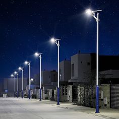 an empty parking lot at night with street lights