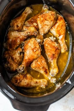 chicken thighs in the slow cooker ready to be cooked