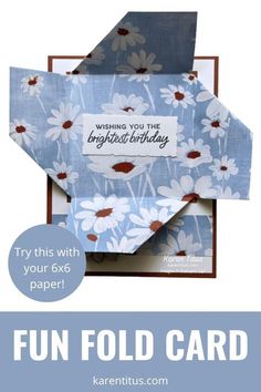 a blue and white birthday card with daisies on it