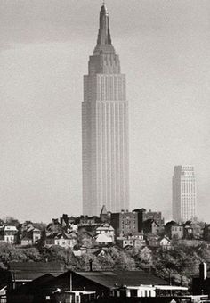 a black and white photo of the empire state building in new york city, ny