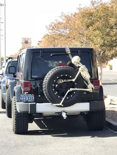 a truck with a skeleton on it's tire