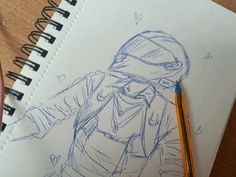 a drawing of a person wearing a helmet and holding a pencil in one hand while standing next to a notebook