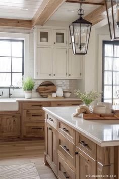 a kitchen filled with lots of wooden cabinets and white counter tops next to a window