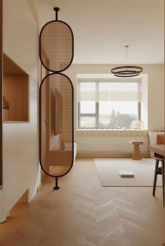 a living room filled with furniture next to a window