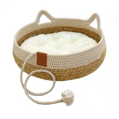 a cat bed with a cord attached to the front and side of it, which has a white cushion on top