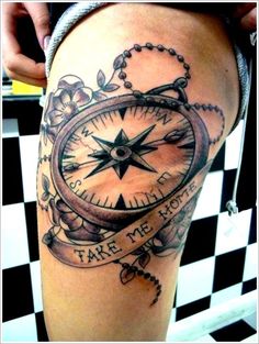 a tattoo with a compass and words on it