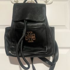 Tory Burch Britten Black Backpack. Thick Soft Pebble Leather Top Handle, Drawstring Closure And Adjustable Straps Overall Good Condition. Please Let Me Know If You Need Additional Pictures. Approximate Measurements: 10”L X 4.5”W X 12”H Tory Burch Britten, Tory Burch Bags, Tory Burch Bag, Black Backpack, Leather Top, Pebbled Leather, Leather Backpack, Top Handle, Tory Burch