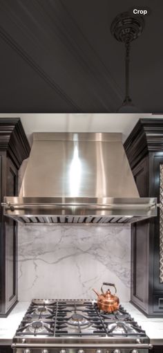 a stove top oven sitting inside of a kitchen