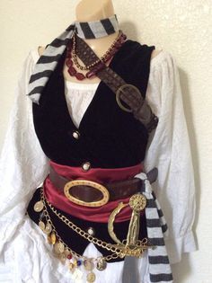 a mannequin is dressed up as a pirate's outfit with chains on it