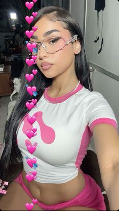 a woman with glasses and pink hearts on her head