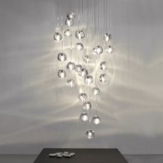 a modern chandelier hanging from the ceiling