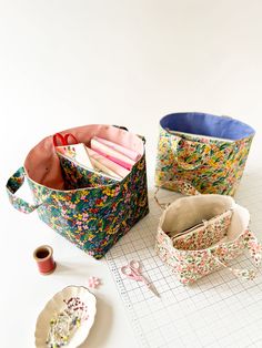 sewing supplies are laid out on a table with scissors and sprinkles in them