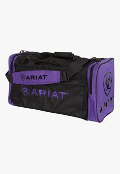 Take on any adventure with the Ariat Junior Gear Bag. Featuring multiple compartments, a detachable shoulder strap and heavy duty fabric to maximise durability and protection. Junior gear bag Heavy duty poly fabric Detachable shoulder strap  Heavy duty zippered end pockets Top zip opening to the main compartment  H11" Wrangler Clothing, Ariat Logo, Mens Socks Fashion, Saddle Cover, Ariat Boots, Luggage Backpack, Gear Bag, Purple Bags, Pocket Top