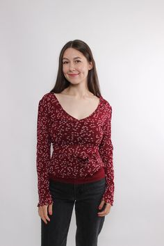 Hi! Welcome to TARASCOMMON.ETSY.COM, your destination for unique clothing from the 20th century! This listing includes a 90s  long sleeve pullover blouse in red color. This top is perfect for adding a touch of retro charm to your wardrobe. Key Features: 90s flowers print sheer blouse Vintage style red floral blouse Size: MEDIUM . Measurements (taken seam to seam while lying flat): Sleeve: 45cm / 17.71inch, Width: 36cm / 14.17inch, Length: 56cm / 22.04inch; Material: POLYESTER. Additional Informa Casual Floral Print Tops For Winter, Casual Long Sleeve Floral Print Blouse, Trendy Long Sleeve Printed Blouse, Vintage Printed Long Sleeve Tops, Trendy Patterned Long Sleeve Blouse, Trendy Long Sleeve Patterned Blouse, Vintage Long Sleeve Printed Tops, Printed Long Sleeve Top For Spring, Casual Burgundy Blouse For Spring