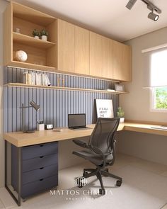 a computer desk sitting under a window next to a shelf filled with books and papers